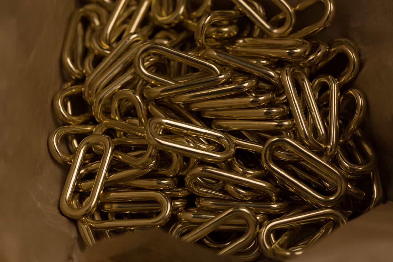 Brass loops in brown paper