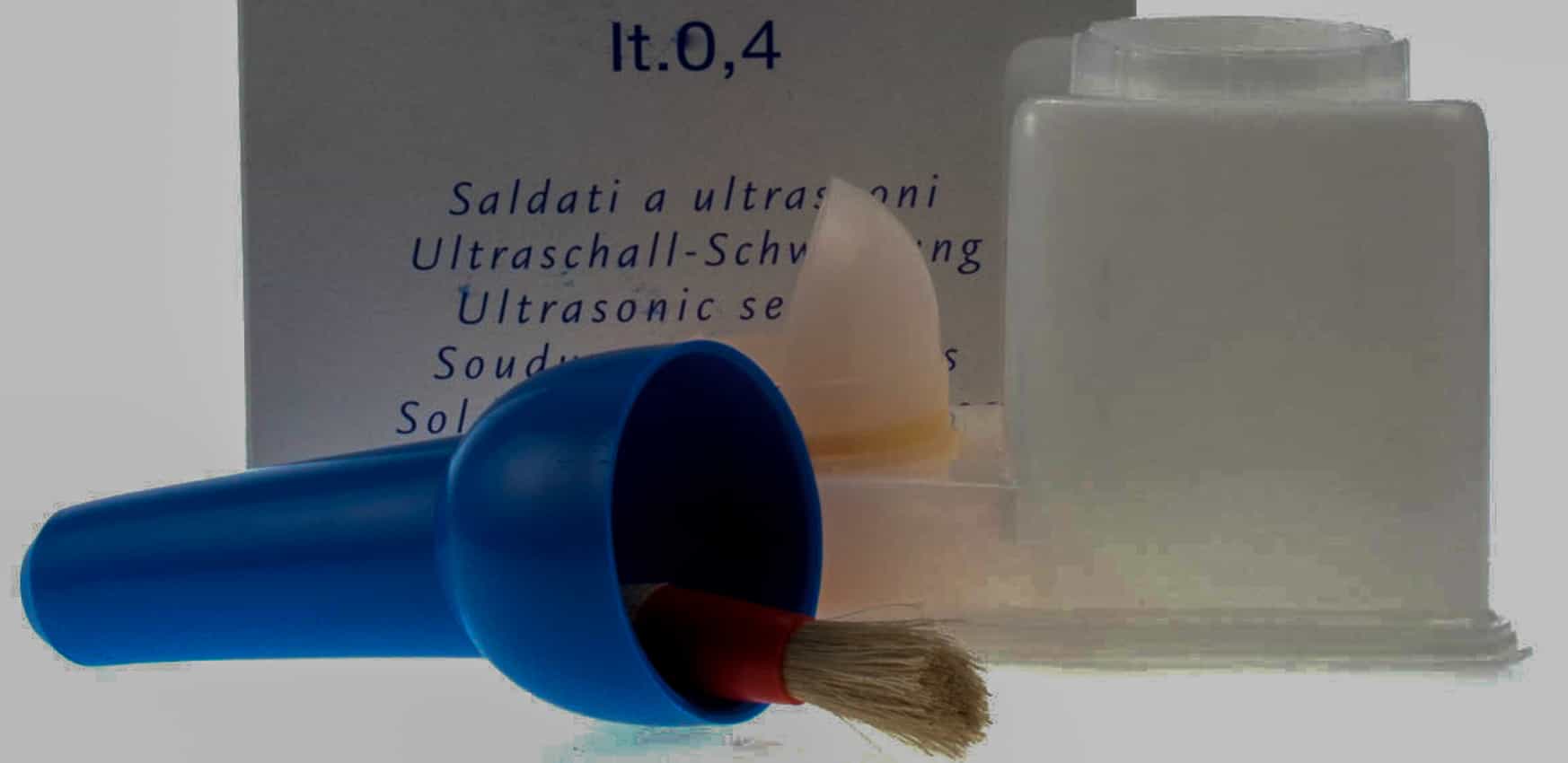 Glue pot and brush for leathercraft projects.